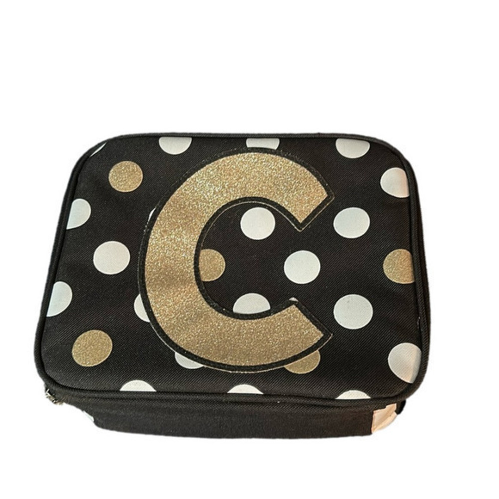 Justice black,white,and gold lunchbox letter C